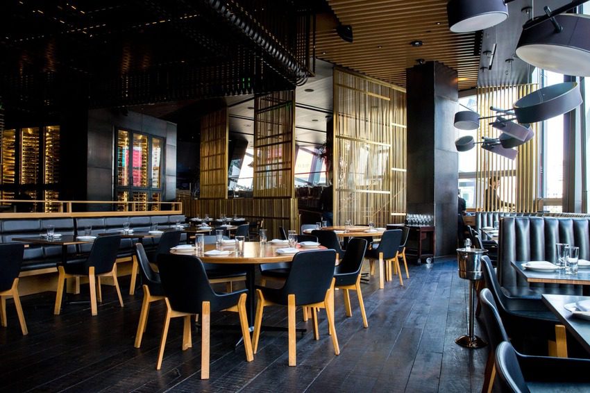 chairs and tables arranged inside of a restaurant