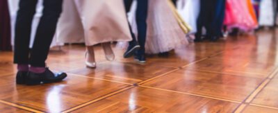 Low angle photograph of couples on a dance floor.