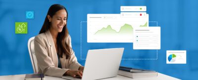 Happy woman in blazer working at computer with stylized revenue management system interface visuals surrounding her.