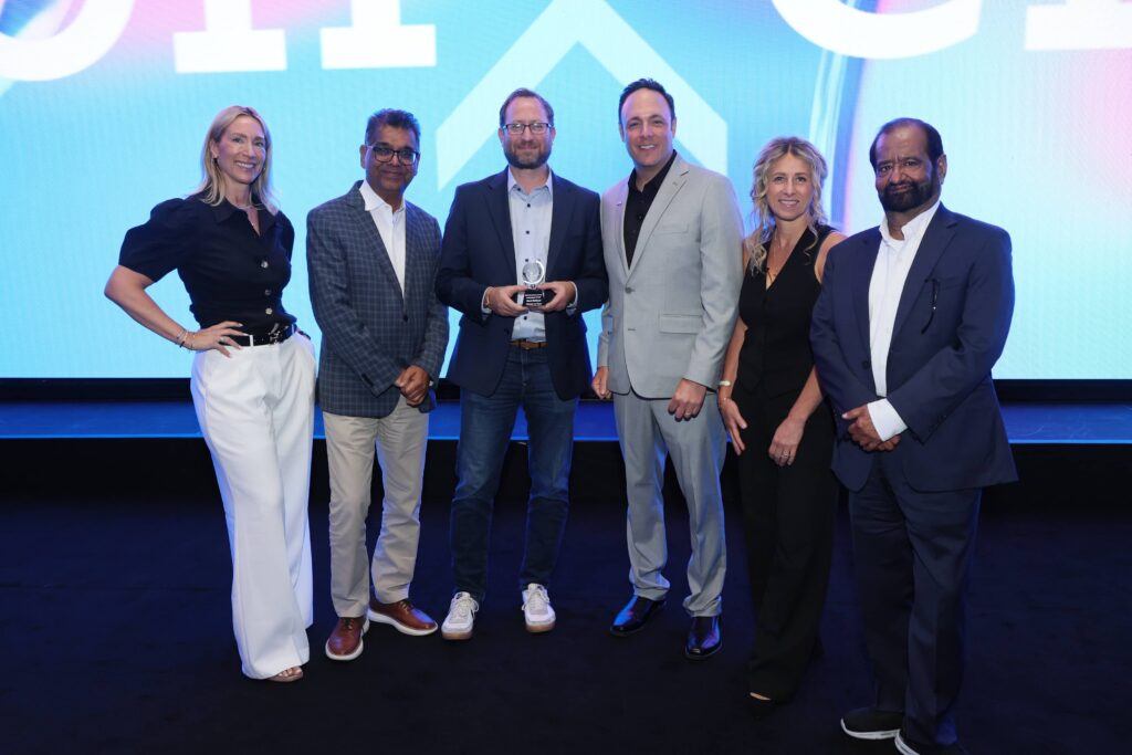 IDeaS leadership presenting 2026 Partnership Award to Mark Molinari